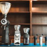 What are the features of a high-end manual coffee grinder?